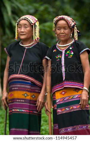 NAN, THAILAND - SEPTEMBER 29 : Khmu old woman with traditional clothes and silver jewelery in neck posing in Khmu hilltribe minority village on September 29, 2011 in Nan Province, Thailand.