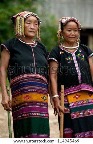 NAN, THAILAND - SEPTEMBER 29 : Khmu old woman with traditional clothes and silver jewelery in neck posing in Khmu hilltribe minority village on September 29, 2011 in Nan Province, Thailand.