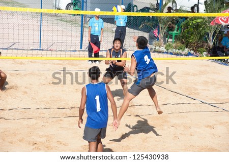 CHONBURI, THAILAND-JAN 18 : Niphon of Institute of Physical education in action during Beach Volleyball 40th. Thailand University Games at Chonburi stadium on Jan 18, 2013 in Chonburi, Thailand .