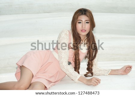 Pretty Asian woman posing on the boat .