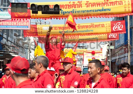 NAKHONSAWAN/ THAILAND-FEB 13 : Oracle (a medium who communicate with spirits) of gods doing ritual at worship parade in Chinese New Year Celebrations on February 13, 2013 in Nakhonsawan  in Thailand.