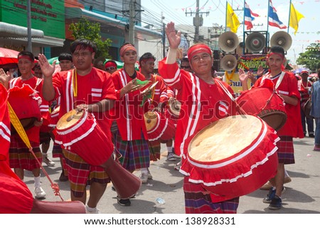 YASOTHON,THAILAND - MAY 11 : Unidentified musician  traditional drum on parades in Rocket festival. The celebration for plentiful rains during the rice plant season,on May11,2013 in Yasothon,Thailand.
