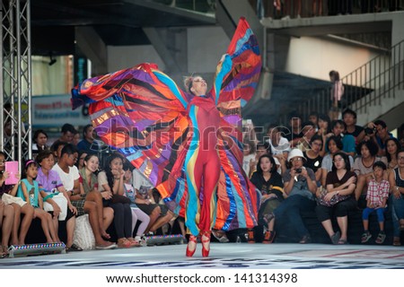 BANGKOK,THAILAND-APRIL 20 : A member of the Dutch group Teatro Pavana performs Venetian style stilt show dancing and enjoy at the Siam center department store on April 20,2013 in Bangkok,Thailand.
