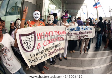 BANGKOK,THAILAND-JUNE 16 : Unidentified demonstrators from the anti- government  V for Thailand group wearing  Guy Fawkes masks attend rally outside shopping mall on June 16,2013 in Bangkok,Thailand.