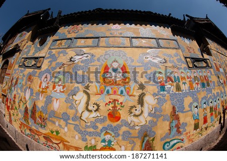 LIJIANG,CHINA - MARCH 17: Tibetan art murals on building in Lijiang is the largest ancient old town on March 17, 2014 in China. It was enlisted as a UNESCO World Heritage List on December 4, 1997 .