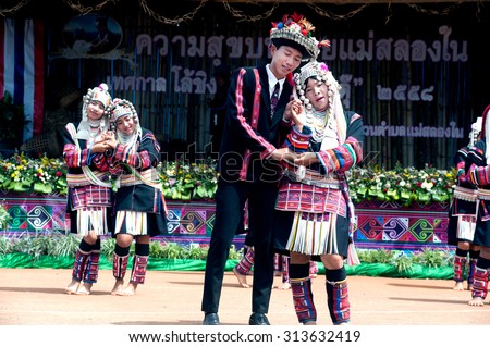 CHIANG RAI,THAILAND-AUGUST 30,2015: The Akha Hill tribe minority traditional dancing on Swing Festival is enjoy music and dance and have a go on the giant swing  on mountain in Northern of Thailand.