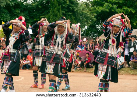 CHIANG RAI,THAILAND-AUGUST 30,2015: The Akha Hill tribe minority traditional dancing on Swing Festival is enjoy music and dance and have a go on the giant swing  on mountain in Northern of Thailand.