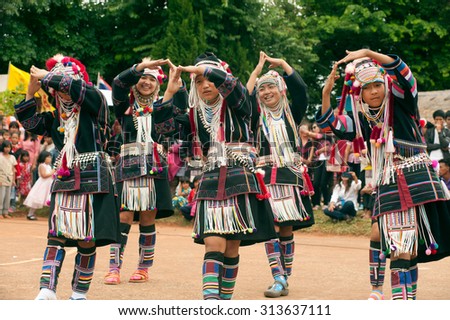 CHIANG RAI,THAILAND-AUGUST 30,2015: The Akha Hill tribe minority traditional dancing on Swing Festival is enjoy music and dance and have a go on the giant swing  on mountain in Northern of Thailand.