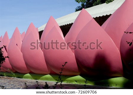 Lotus statues at base of Thai church in temple Middle of Thailand.
