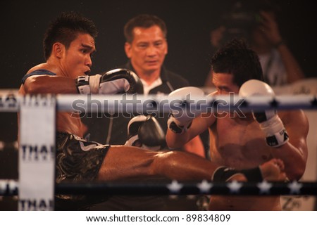 BANGKOK-NOV 27:Unidentified fighters fight Muay Thai at \'Thai Fight Muay Thai...The World\'s Unrivaled fright\' at Imperial Sumrong stadium on November 27,2011 in Bangkok,Thailand.