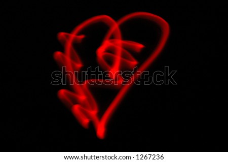 A heart made by moving a lamp, hidden behind a thumb, in front of a camera. Red color comes from a blood vessels in the thumb.