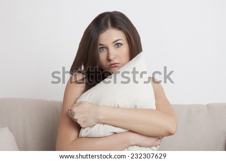 The girl on the couch. emotion. Interior light room