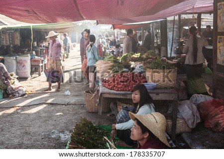 NYAUNGSHWE, MYANMAR - FEBRUARY 15: Mingalar Market, is a big market selling rice, fish, vegetables, flower, clothes, souvenirs on Feb 15, 2014 in Nyaungshwe, Myanmar.