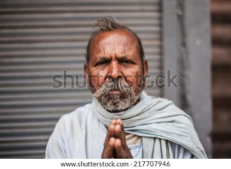 AGRA, INDIA - APRIL 12: Unidentified Old man pray and poses for photo shooting on Apr 12, 2014 in Agra, India.