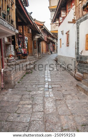 LIJIANG, CHINA - APRIL 12: Alley of Lijiang old town, It\'s a mainly non-Han town with a traditional Nakhi culture of the majority ethnic group on April 12, 2009 in Lijiang, China.
