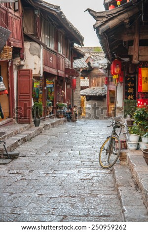 LIJIANG, CHINA - APRIL 12: Alley of Lijiang old town, It's a mainly non-Han town with a traditional Nakhi culture of the majority ethnic group on April 12, 2009 in Lijiang, China.