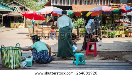 MON STATE, MYANMAR - MARCH 03 : Unidentified Vendors selling foods and souvenir at Kyaiktiyo old market, This market is entrance of Golden Rock Pagoda on March 03, 2015 in Mon State, Myanmar.