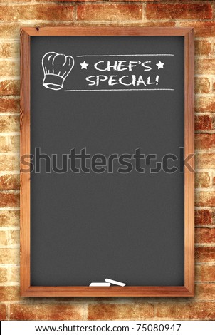 chef\'s special chalkboard on brick wall