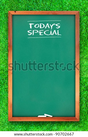 today special chalkboard on grass background