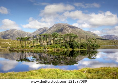 Mountainous landscape reflected in Derryclare Lough, in the Inagh Valley, County Galway, Ireland.