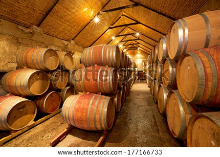 PAARL, SOUTH AFRICA - APRIL 19, 2012: Wine maturing in French oak barrels in the wine cellar at Vondeling Wines in the Paarl Wine Region of South Africa.