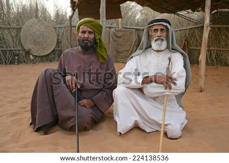 DUBAI - MARCH 8, 2005: Two Arab men at their camp near Dubai. The older man on the right is blind.