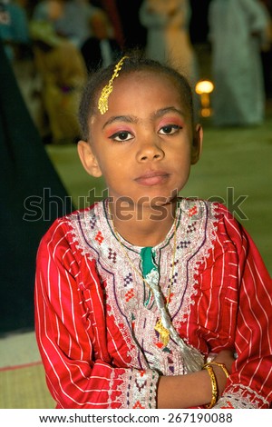 MUSCAT, OMAN - FEBRUARY 1, 2008: An Omani girl in traditional dress at a cultural festival in Muscat, in the Sultanate of Oman.