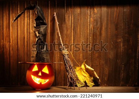 Jack o lanterns  Halloween pumpkin face on wooden background and spooky