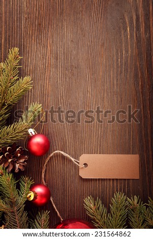 Christmas Tree and decorations on wooden background paper for labels