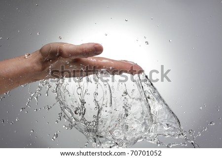 hand in water stream