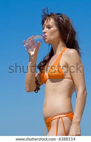 Fitness model demonstrating the benefits of drinking water