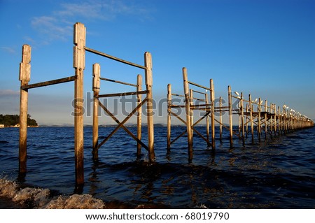 Side view of an old pier structure made of wood
