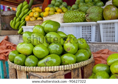 Avocado\'s in basket in outdoor market, southeast Asia