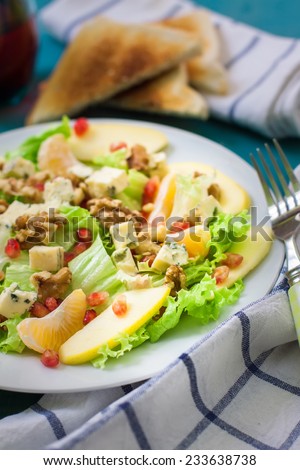 salad with pomegranate lettuce blue cheese and fruits
