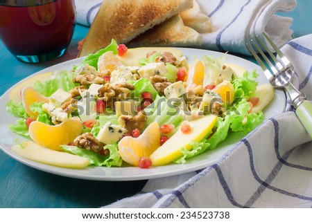 salad with pomegranate lettuce blue cheese and fruits