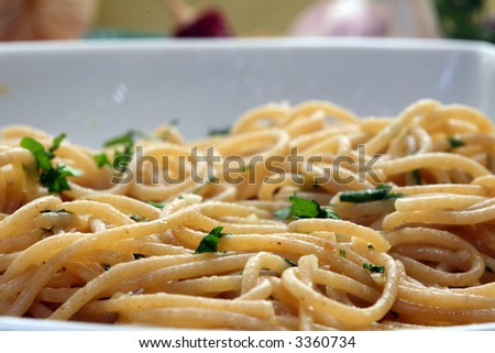 Plate of spaghetti with tomato sauce and a parsley