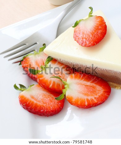 three types of chocolate cake with strawberries.