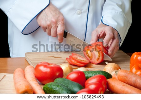 Food preparation Ã¢Â?Â? cutting a fresh tomato