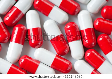 Red and white pills, view from above