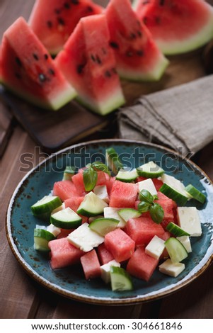 Salad with watermelon, cucumber and bryndza cheese, close-up