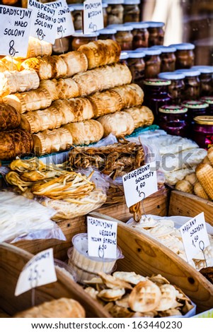 Traditional polish smoked cheese oscypek on outdoor market in Zakopane