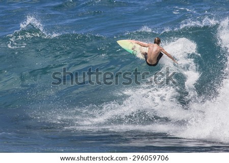 MAUI, HI - MARCH 09: Professional surfer rides a giant wave at the legendary big wave surf break \