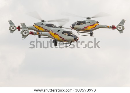 RADOM, POLAND - AUGUST 23:Aerobatic Spanish helicopter patrol (ASPA Patrol) perform during Air Show Radom on August 23, 2015
