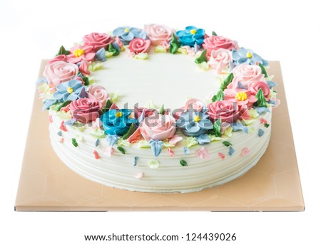 Birthday cake with flowers on white