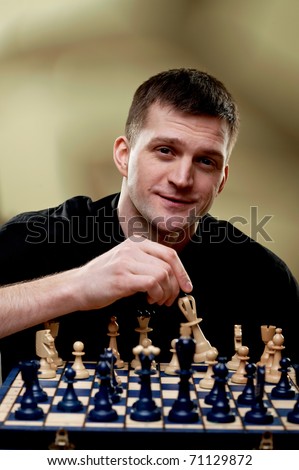 Chess player at a chess board