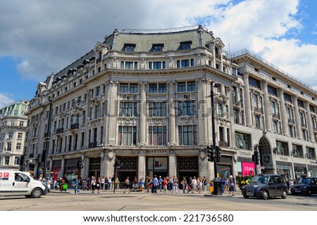 LONDON - JULY 1, 2014: Nike town, the famous sports store on Oxford circus in London. Up to over 40.000 pedestrians per hour pass the junction, it is the highest pedestrian volumes recorded in London.