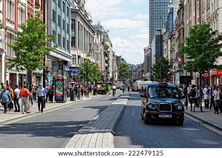 LONDON - JULY 1, 2014. Shoppers on Oxford street, the biggest shopping street in Europe, visited by millions of tourists.