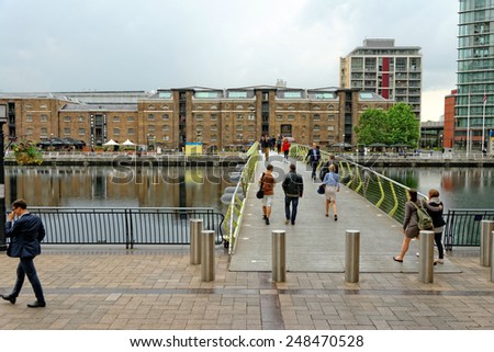 LONDON, UK - JULY 1, 2014: Canary Wharf, located in West India Docks on Isle of Dogs once formed part of the busiest port in world. Now it is a major business district (1,300,000 sqm) in London.