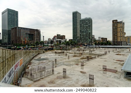 LONDON, UK - JUNE 30, 2014: Canary Wharf, located in West India Docks on Isle of Dogs once formed part of the busiest port in world. Now it is a major business district (1,300,000 sqm) in London.