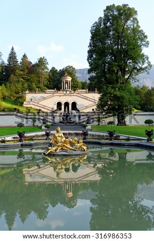 ???RAMMERGAU, GERMANY - AUGUST 11, 2015: Linderhof Palace Terrace Gardens in the southern part of the park, designed in the Italianate garden style in the Bavarian Alps.